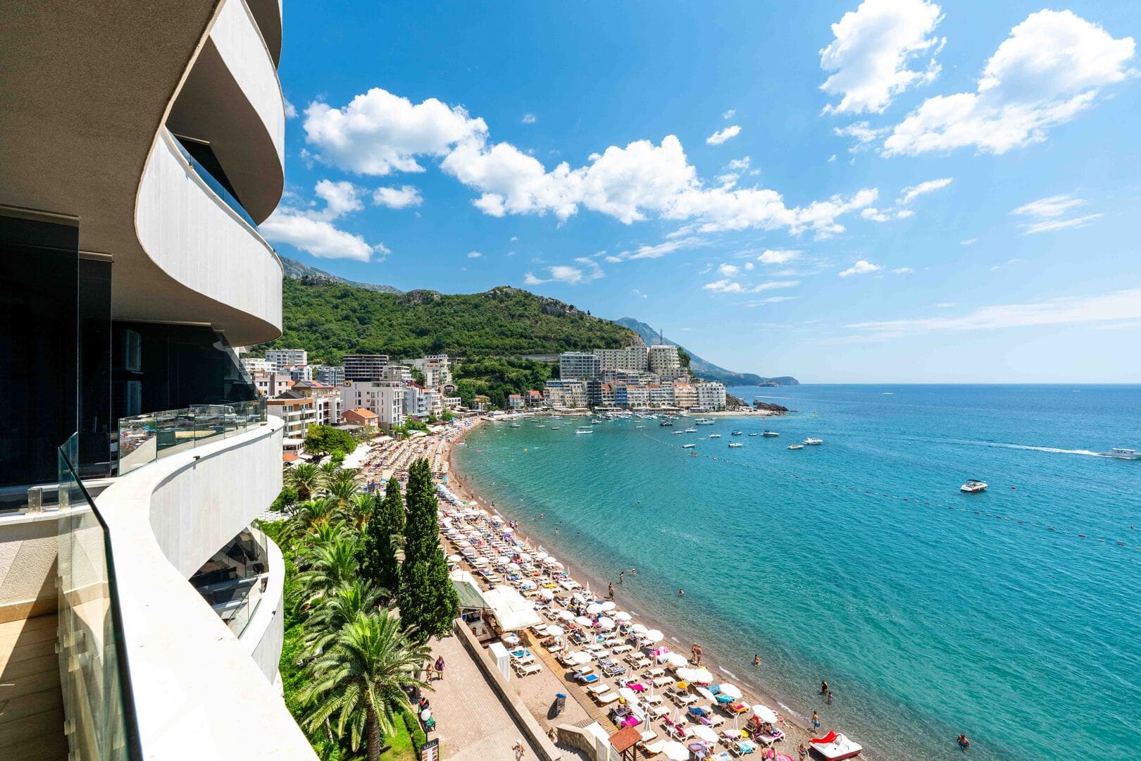 View of the beach and the sea from the balcony of a luxury apartment in Bečići, Budva.