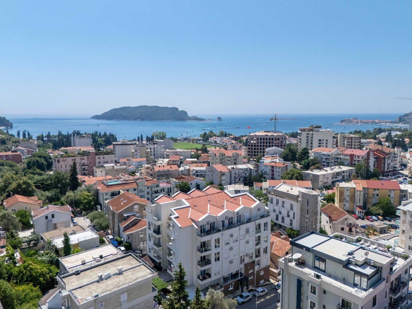 View of the sea and the coast of Budva with luxury apartments in the city center.